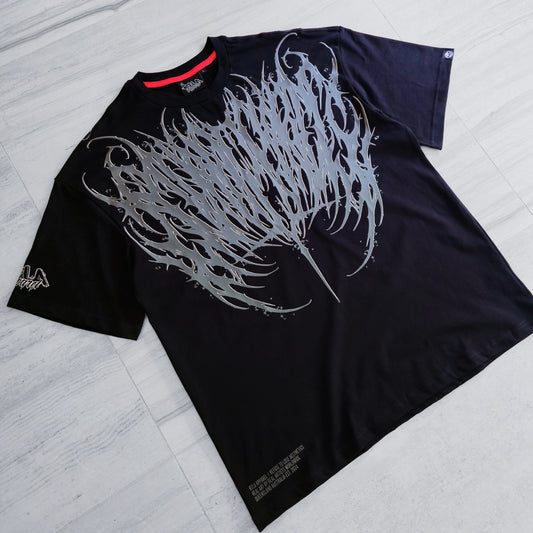 Black t-shirt with white graphic design on a light gray surface