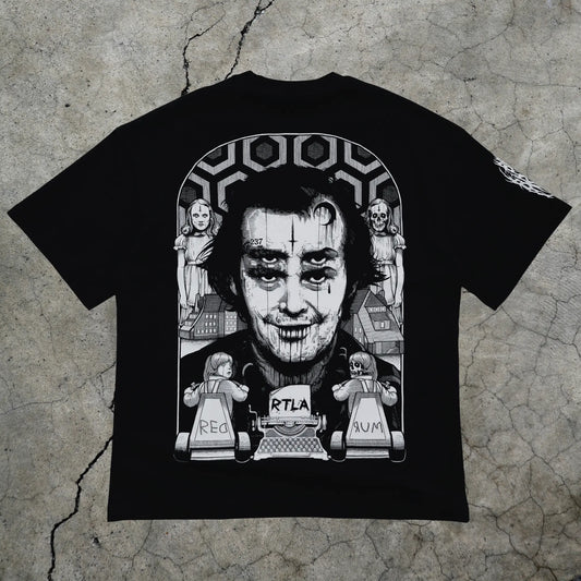 Black t-shirt with graphic design on a textured surface