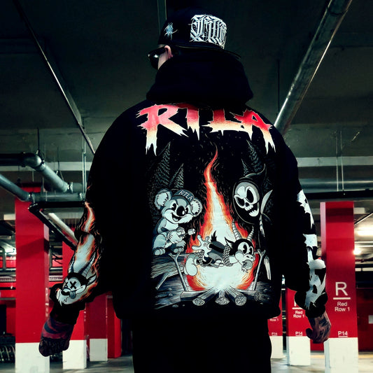 A person viewed from behind wearing a black hoodie with a large graphic print on the back, featuring the word 'R.I.