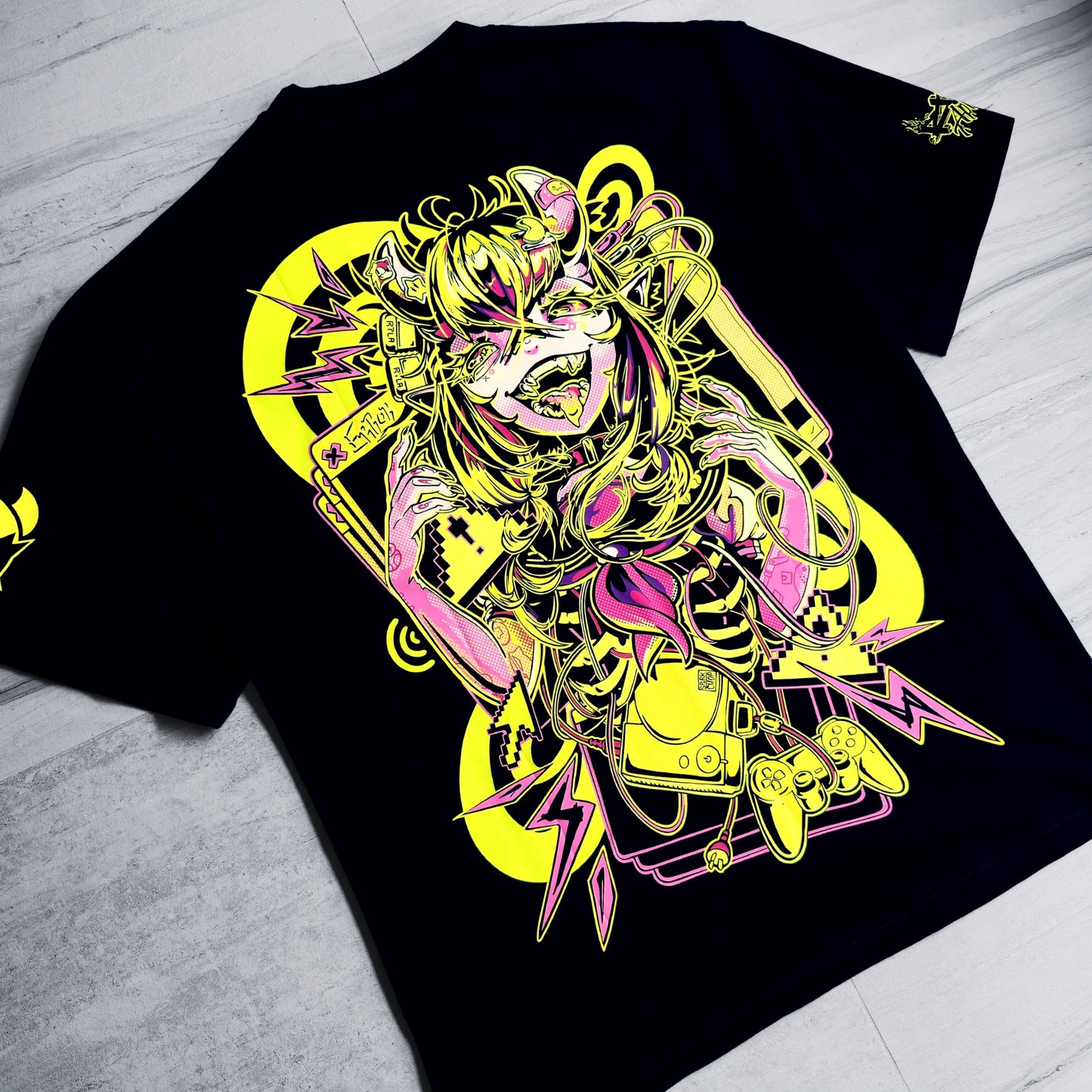 Black t-shirt with a colorful graphic design on a light gray surface