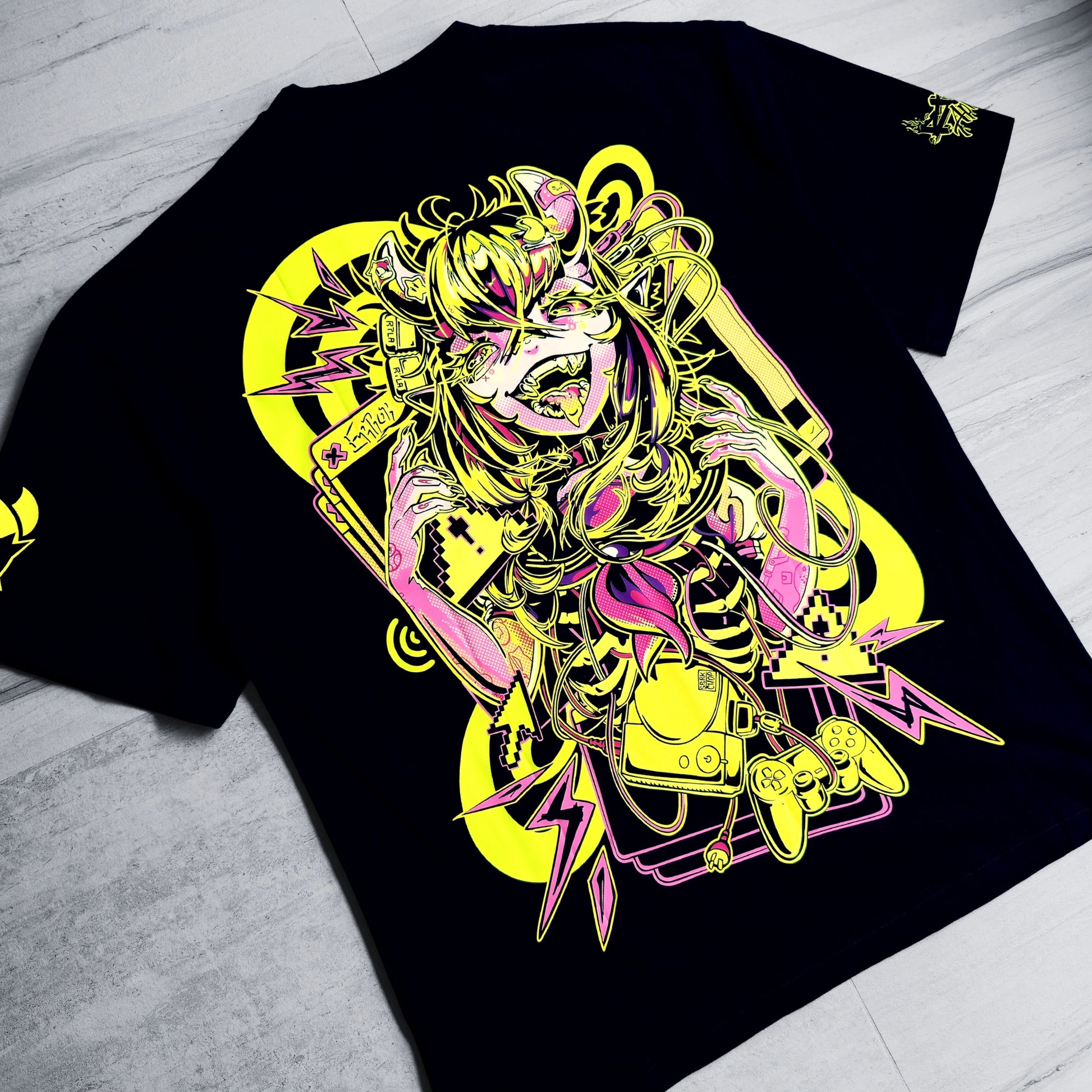 Black t-shirt with a colorful graphic design on a light gray surface