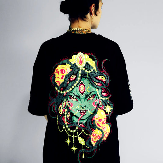Person wearing a black t-shirt with a colorful and detailed design on the back.