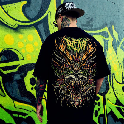 Person wearing a black t-shirt with a colourful dragon design in front of a graffiti wall. RTLA-Apparel