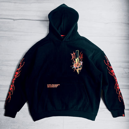 Black hoodie with red and orange designs on a light gray background