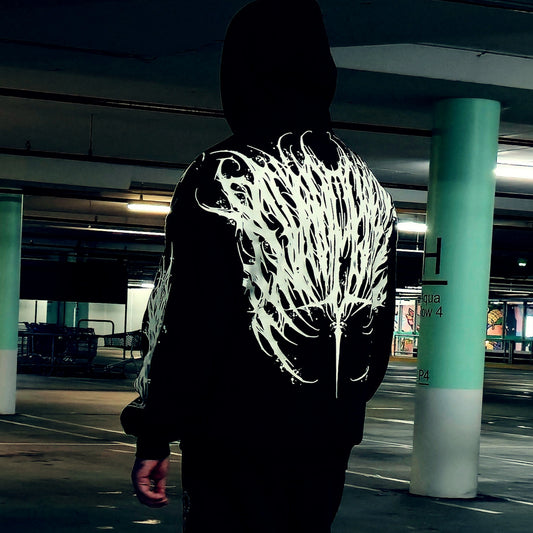 Person wearing a black hoodie with white design in front and back