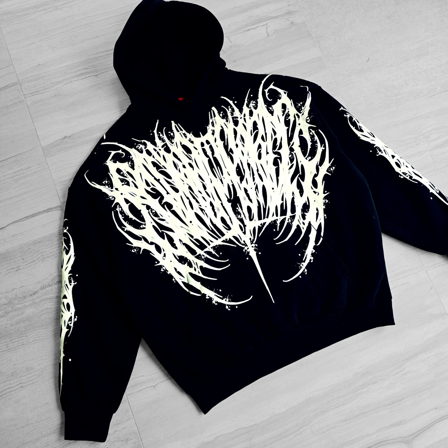 a black hoodie with white design in front and back