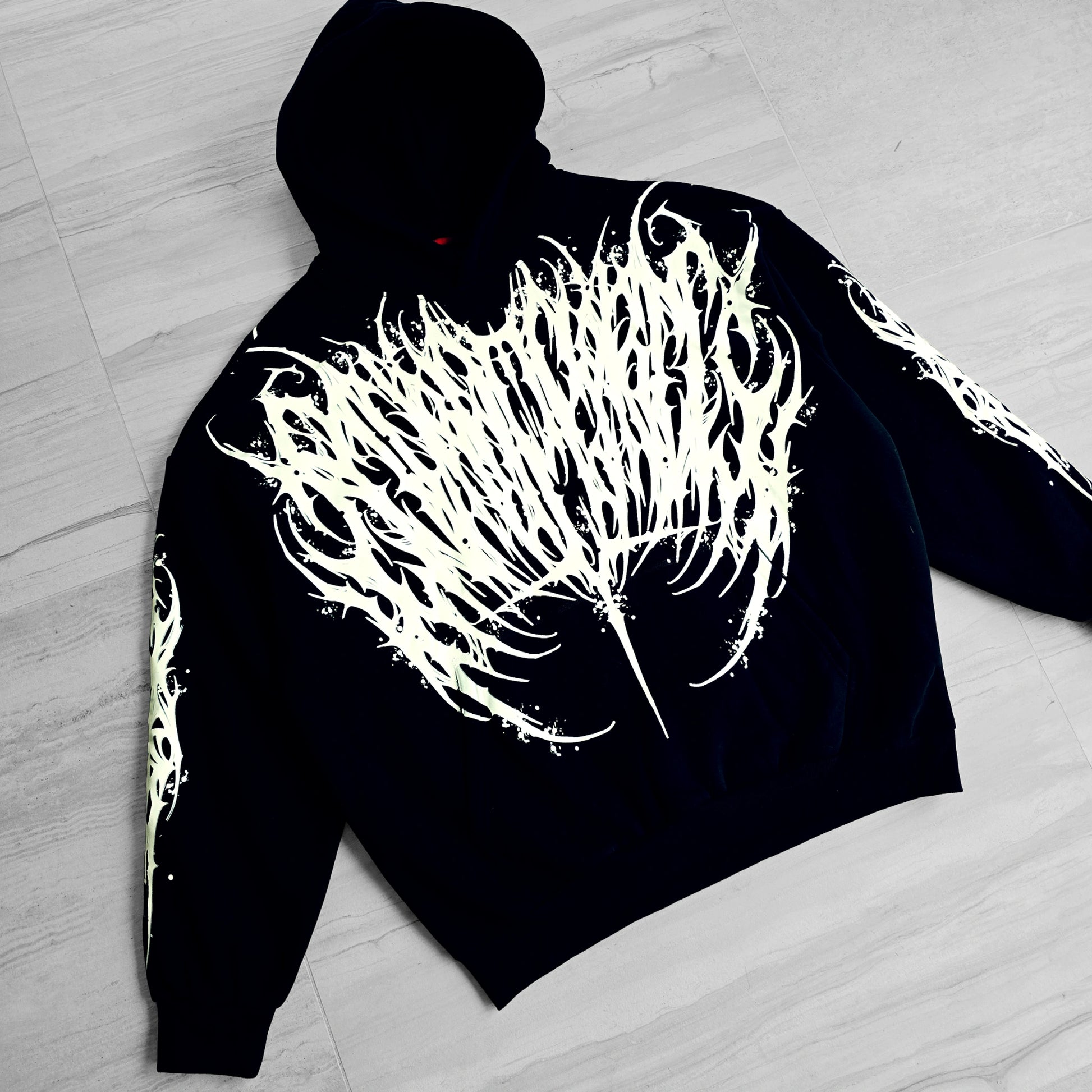 a black hoodie with white design in front and back