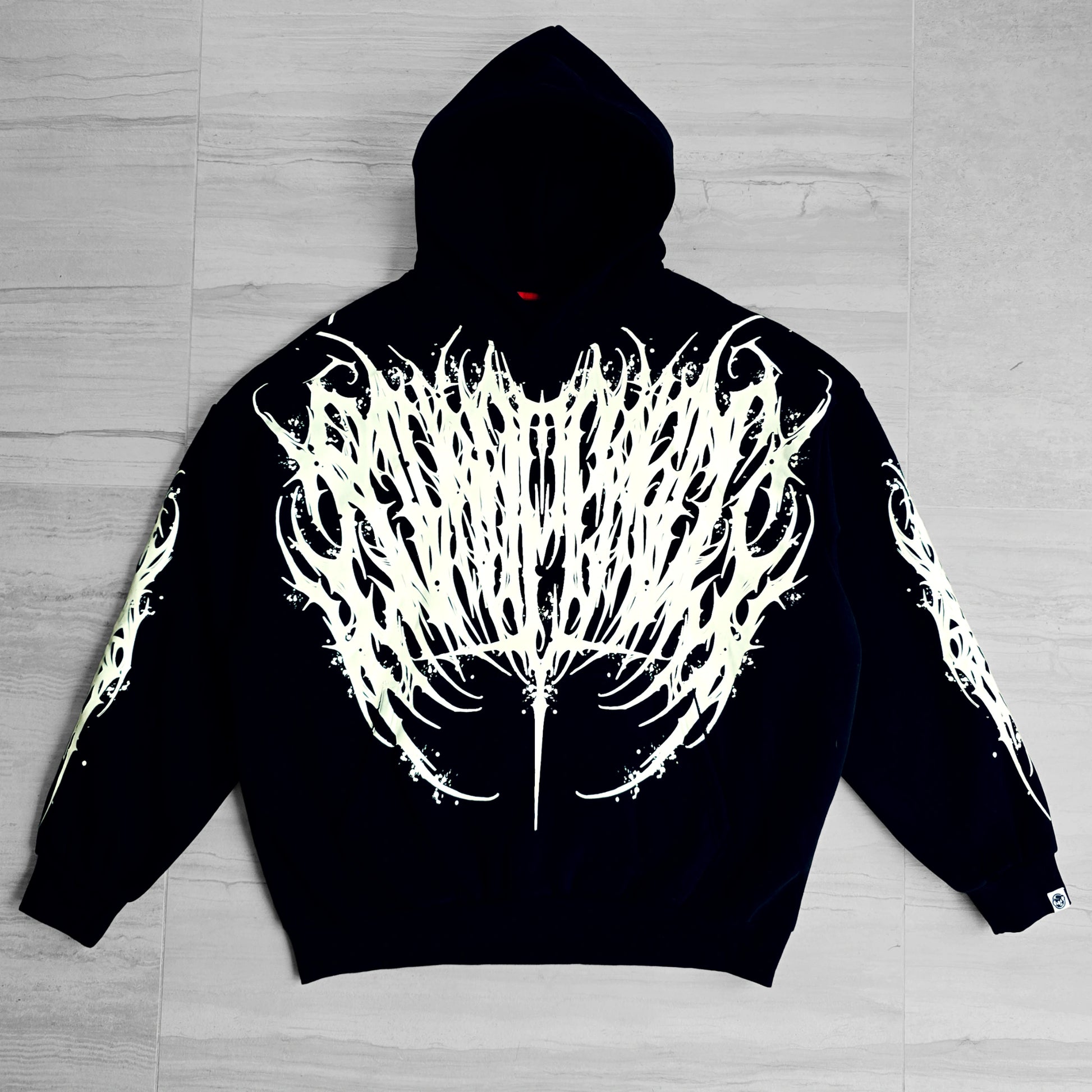 a black hoodie with white design in front and back
