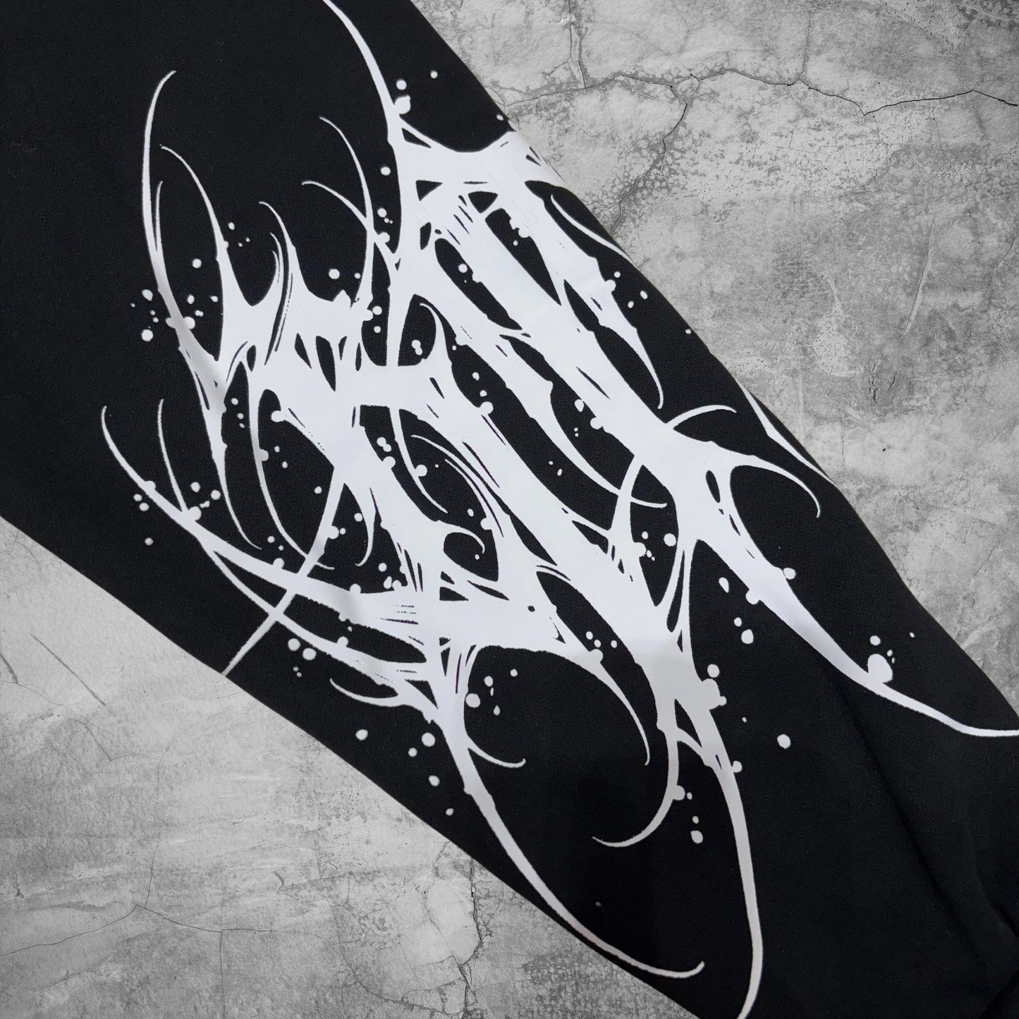 Black and white abstract design on a textured surface