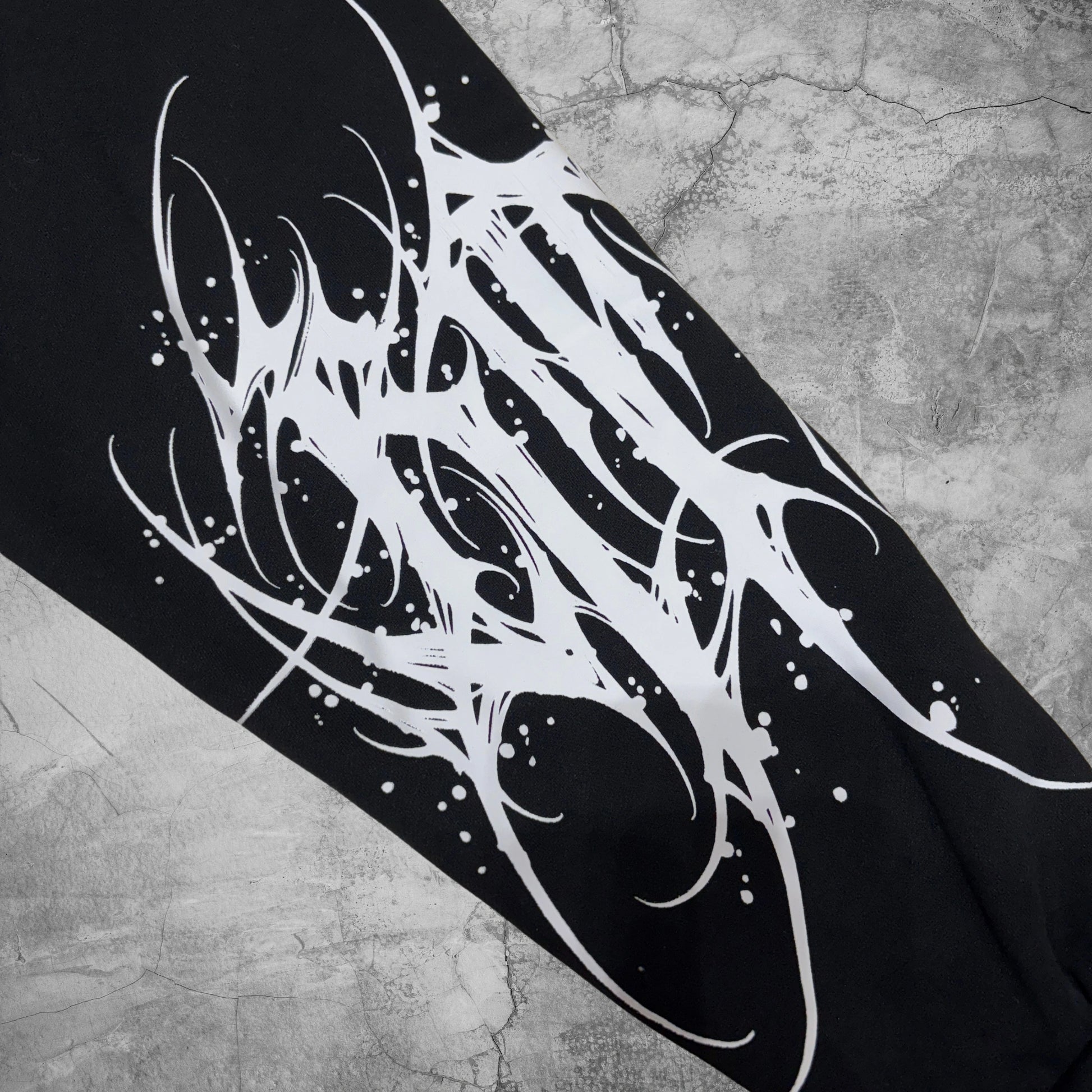 Black and white abstract design on a textured surface