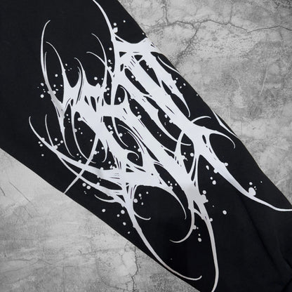 Black and white abstract design on a textured surface