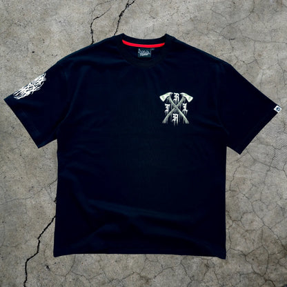 Black t-shirt with white graphic design on a textured gray surface