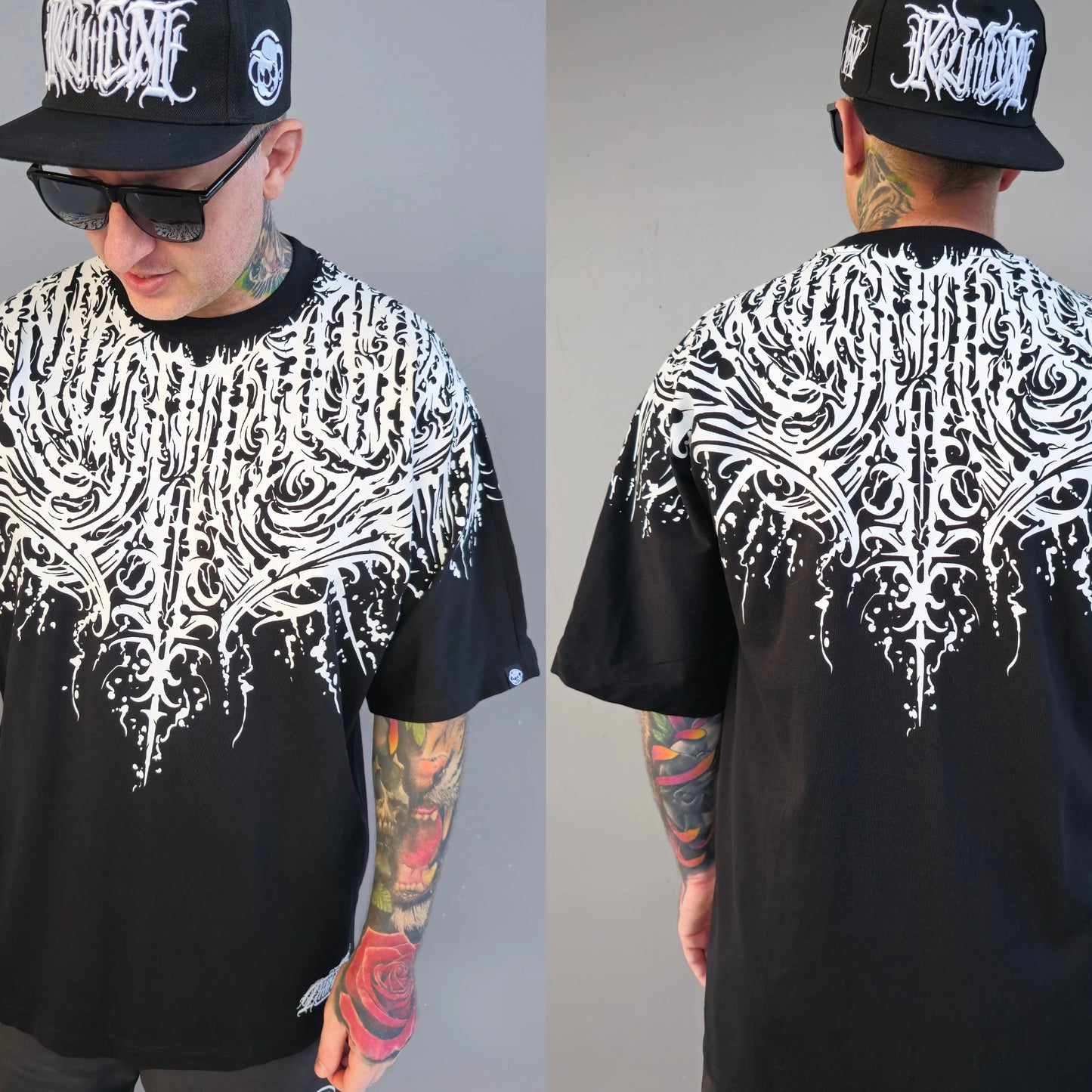A person wearing a black oversized t-shirt with a white text and script work design, mirrored on both front and back.  RTLA Apparel