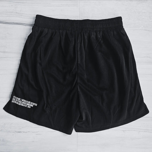 Black shorts with white text on a light gray background