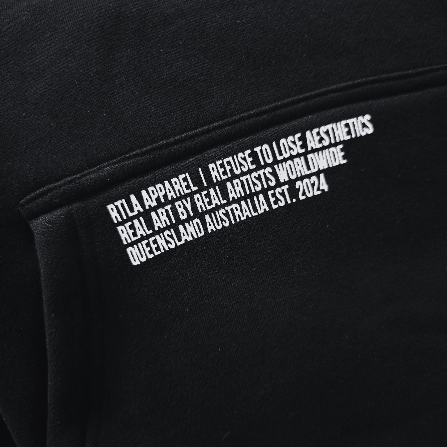 Black sweatshirt with white text on a black background