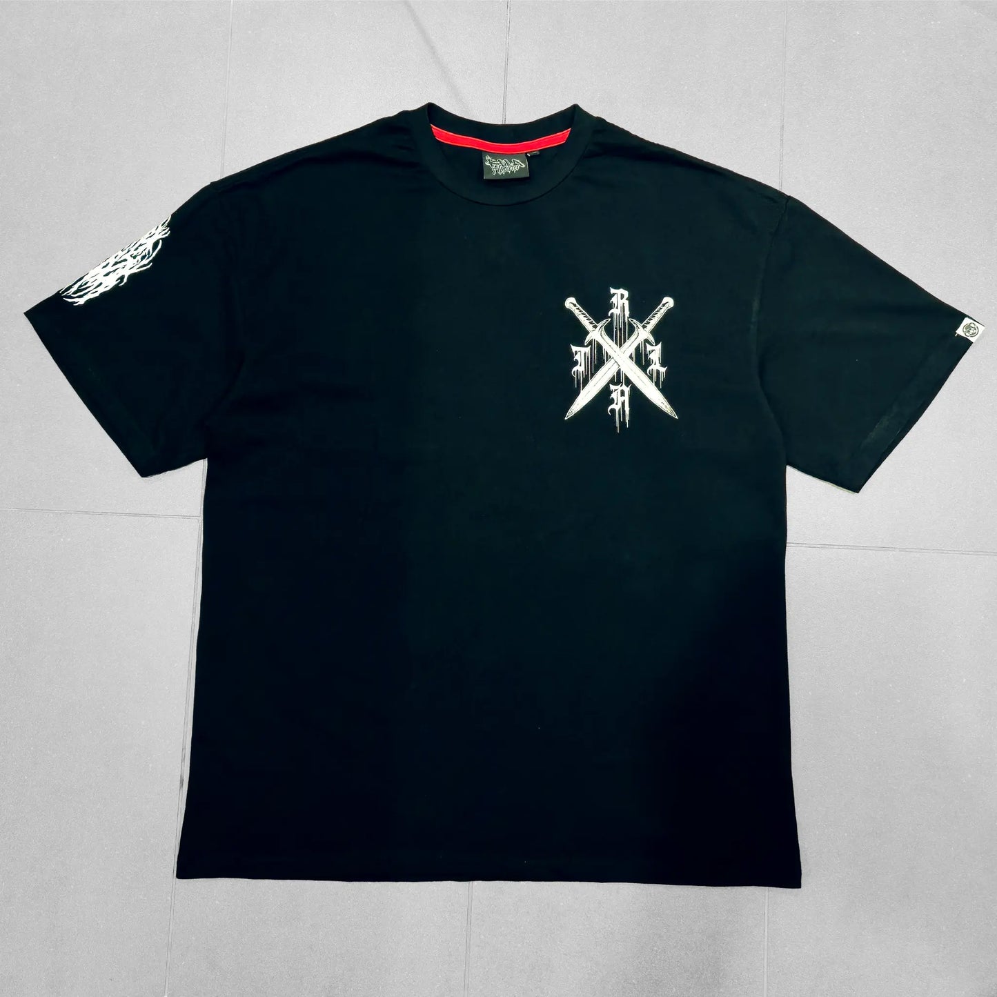 Black t-shirt with a white logo on a light gray background