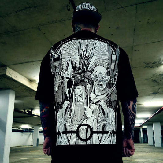 Person wearing a black t-shirt with graphic design in an urban setting