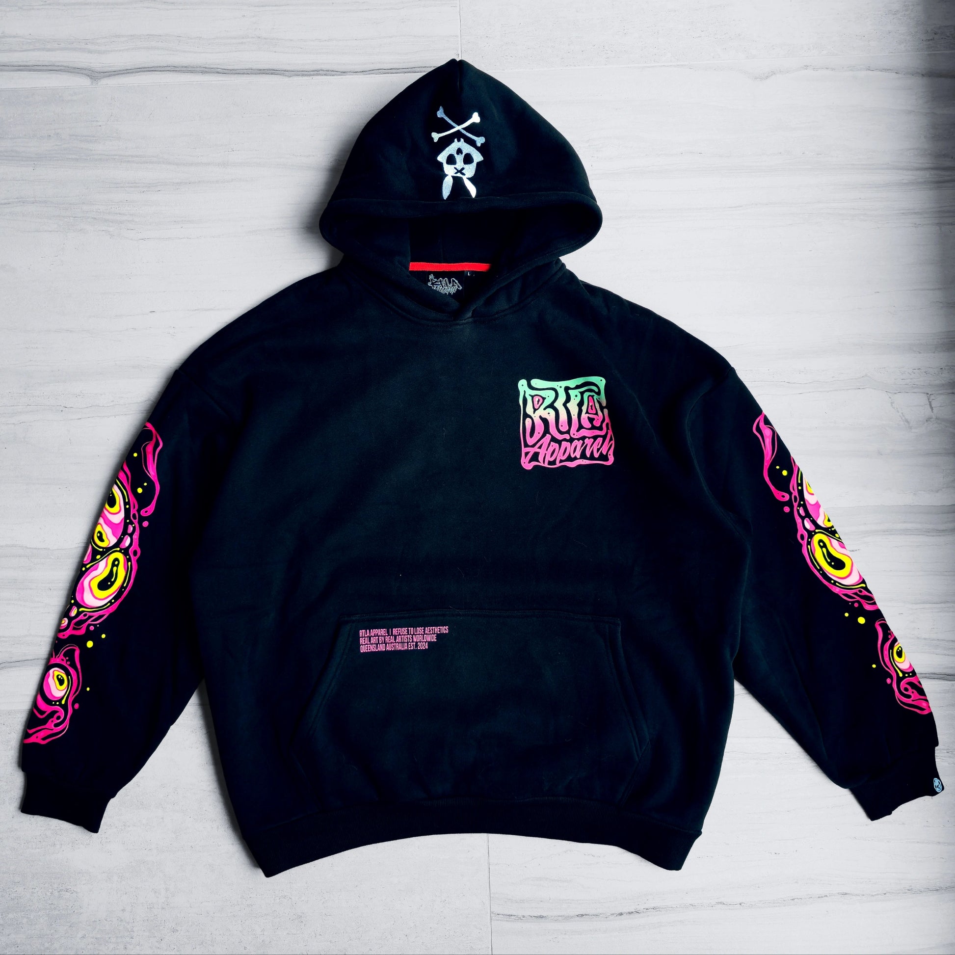 Black hoodie with colorful designs on a light gray background