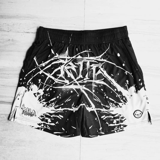 Black shorts with white abstract design on a light wooden floor