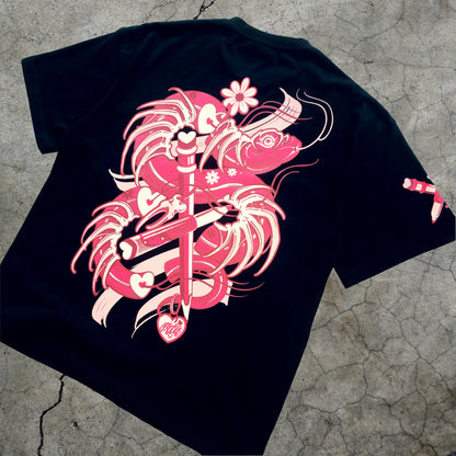 Black t-shirt with pink graphic design on a textured surface